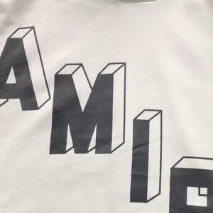 Unisex oversized AMIRI graphic hoodie in black and white streetwear style