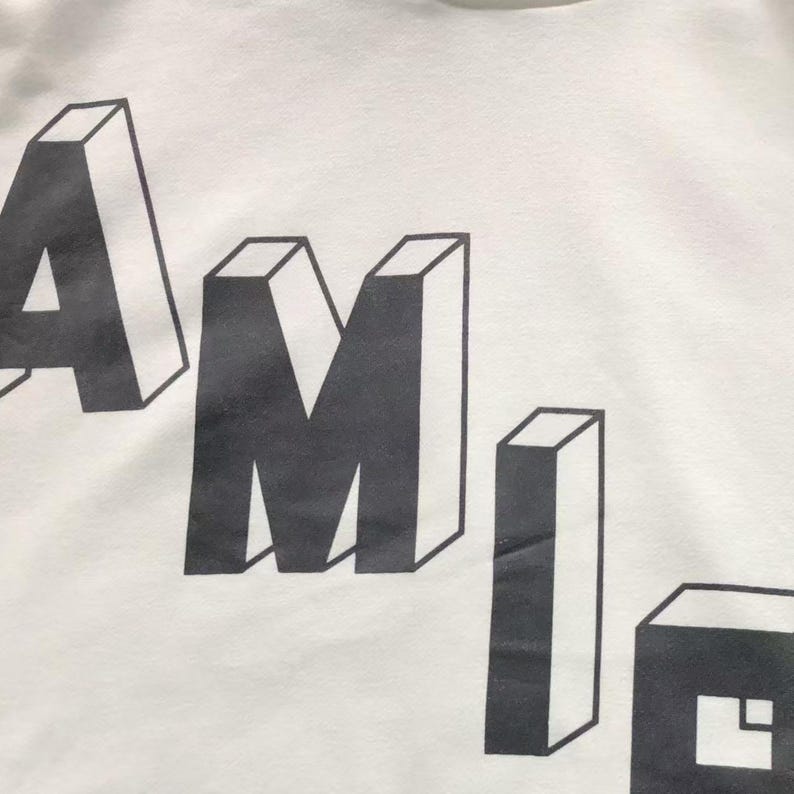 Unisex oversized AMIRI graphic hoodie in black and white streetwear style