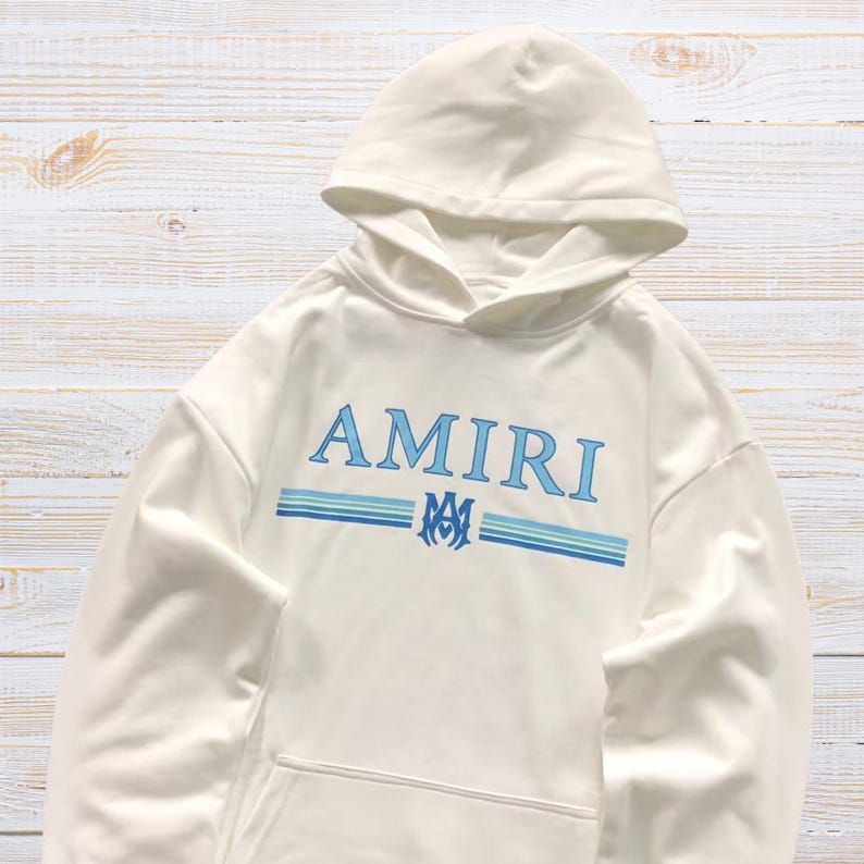 Unisex AMIRI-style hoodies in black and white with bold front graphic and stripe design, pullover streetwear sweatshirts with hood and kangaroo pocket.
