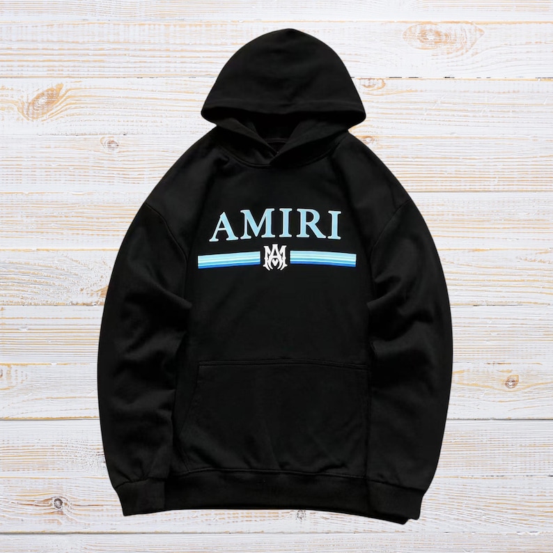 Unisex AMIRI-style hoodies in black and white with bold front graphic and stripe design, pullover streetwear sweatshirts with hood and kangaroo pocket.