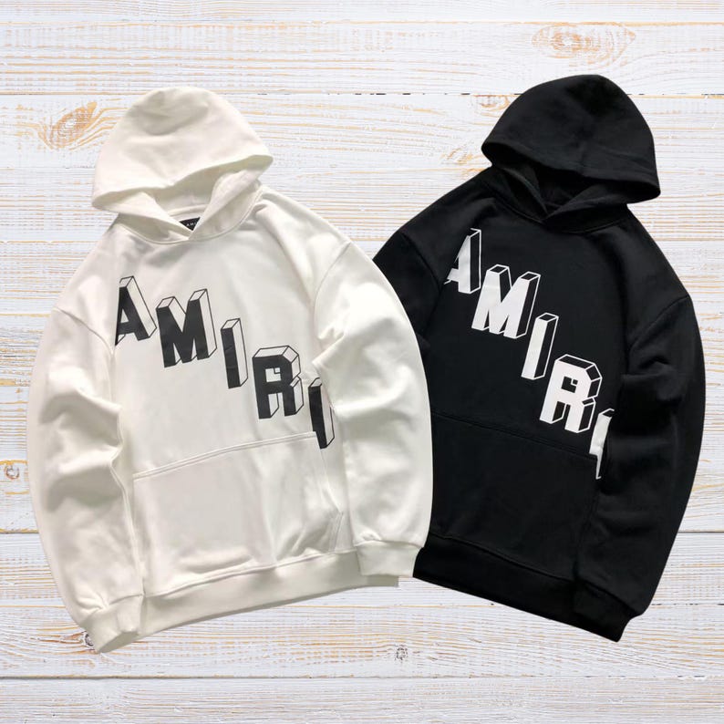 Unisex oversized AMIRI graphic hoodie in black and white streetwear style
