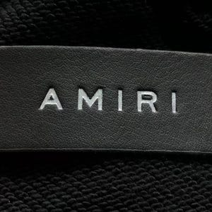 Unisex oversized AMIRI graphic hoodie in black and white streetwear style