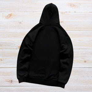 Unisex oversized AMIRI graphic hoodie in black and white streetwear style