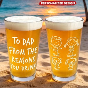 May include: Two personalized pint glasses filled with beer, featuring white text and illustrations. One glass reads "To Dad From The Reasons You Drink." The other glass has stick figures and pet illustrations with names. The glasses are on a sandy beach.