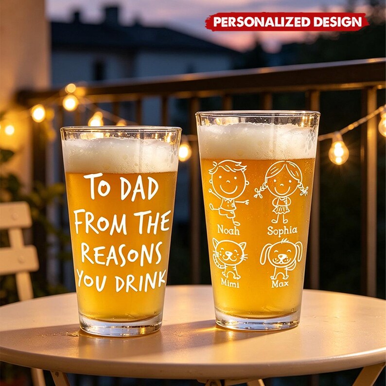 May include: Two personalized pint glasses filled with beer, sitting on a table. One glass reads "To Dad From The Reasons You Drink." The other glass features cartoon drawings of a boy, a girl, a cat, and a dog, with names below.