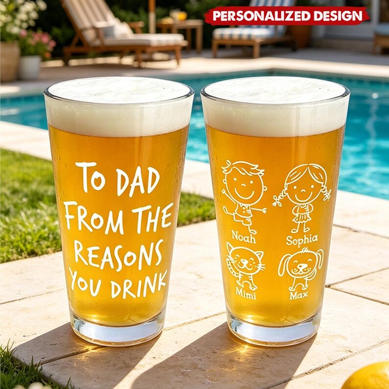 May include: Two clear pint glasses filled with beer and foam. One glass has the text "TO DAD FROM THE REASONS YOU DRINK". The other glass has cartoon drawings of a boy, girl, cat, and dog with names. The glasses are on a stone surface.