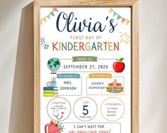 May include: A framed personalized first day of kindergarten sign for Olivia featuring colorful illustrations of a globe, apple, school building, and backpack. The text includes the date September 27, 2026, teacher Mrs. Johnson, school name, and age 5.