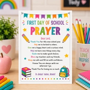 May include: A rectangular sign with the text First Day of School Prayer, featuring colourful illustrations of pencils, a stack of books, and a backpack. The prayer text is printed in black with colourful accents, framed by a decorative bunting banner.