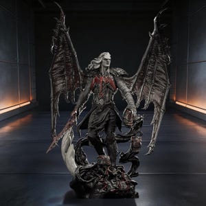 May include: A detailed statue of a character with long white hair, large bat-like wings, and a dark costume with red accents. The figure holds a weapon and a skull-like object, standing on a base with additional skulls and organic shapes. The statue is predominantly black and gray.