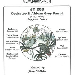 May include: Stained glass pattern for a 34 1/2 inch round Cockatoo & African Grey Parrot. The pattern includes suggested colors for the Cockatoo, Parrot, Tail, Eye Area, Flowers, Vines, Bill & Claws, and Background.