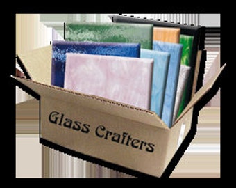 May include: A box of assorted glass tiles in various colors, including green, blue, pink, and brown. The box is labeled "Glass Crafters".