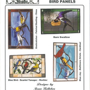 May include: Four stained glass panels depicting North American birds. The panels feature a barn swallow, a blue jay, a Baltimore oriole, and a cardinal. The panels are titled "JT 212 (4) North American Bird Panels" and are designed by Joan Kelleher.