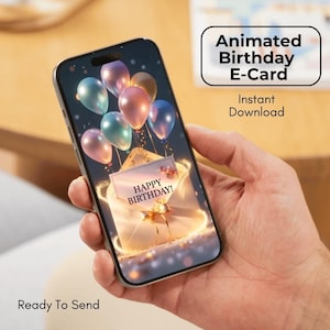 Pode incluir: Um smartphone exibe um e-card de aniversário animado com balões coloridos e a mensagem "Happy Birthday!". O telefone é segurado em uma mão, com o texto "Ready To Send" na parte inferior.