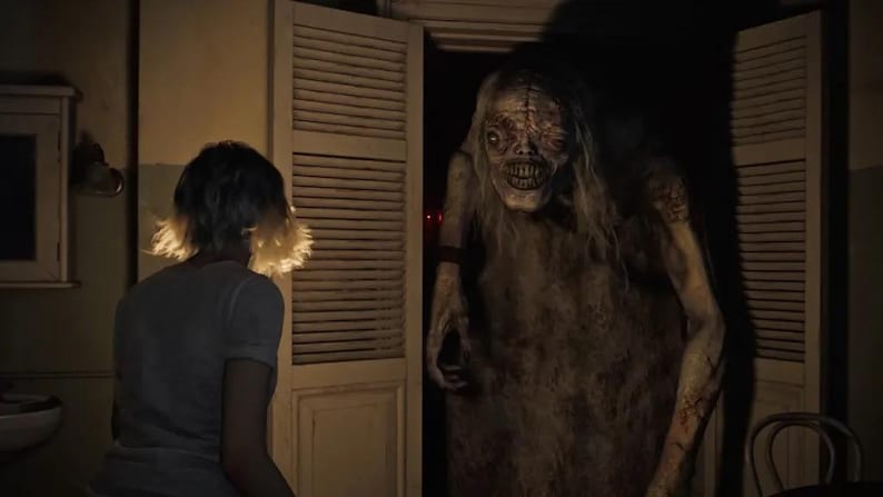 May include: A chilling image of a monstrous figure with long hair and a distorted face in a doorway. A person in a t-shirt is facing the creature. The scene is dark, creating a horror atmosphere.