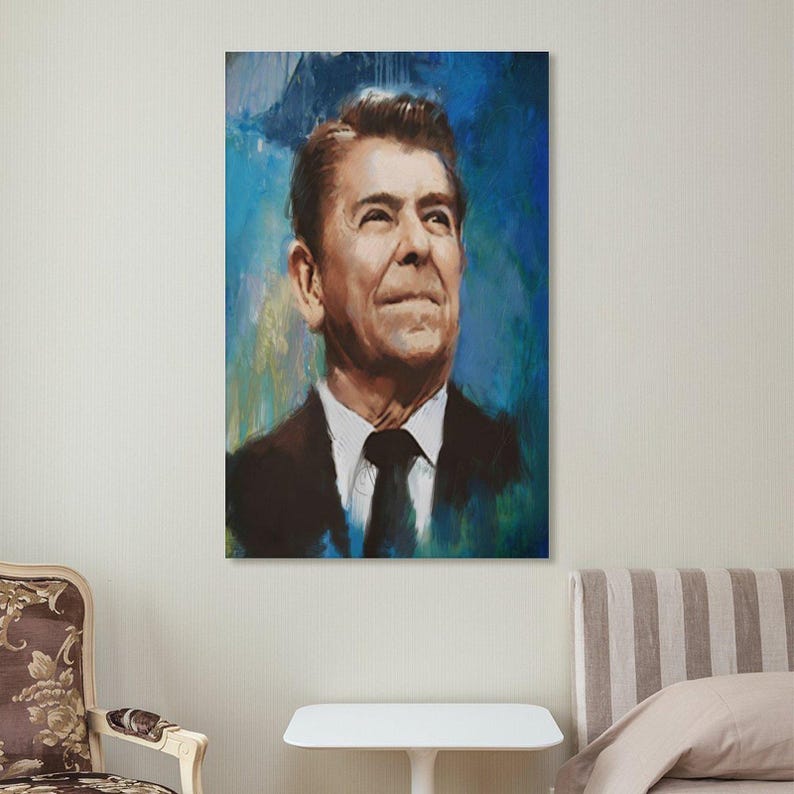 May include: A vertical rectangular wall art print featuring a painted portrait of Ronald Reagan. The subject is depicted from the chest up, wearing a dark suit, white shirt, and black tie, set against a vibrant, textured blue and teal background.