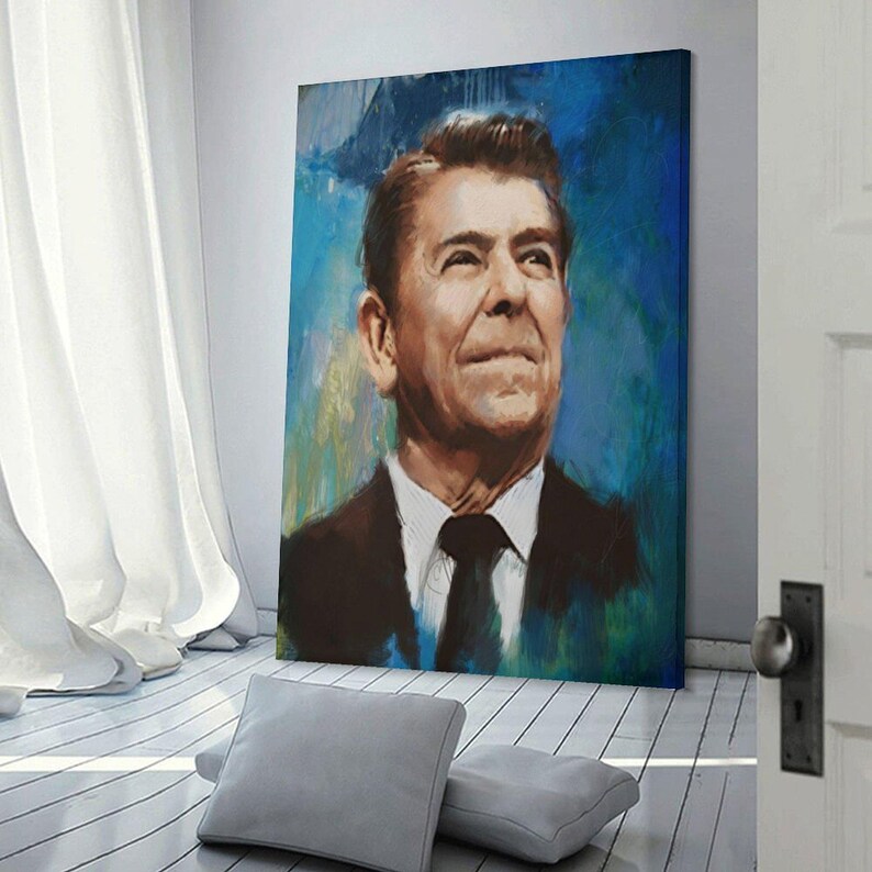 May include: A rectangular canvas print featuring a portrait of Ronald Reagan in a dark suit and tie. The painting uses expressive brushstrokes with a vibrant blue and green background, capturing the subject looking upward with a neutral expression.