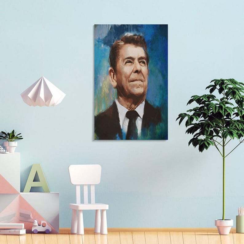 May include: A rectangular wall art print featuring a portrait of Ronald Reagan. The subject is depicted wearing a dark suit, white shirt, and dark tie against a textured, abstract blue and yellow background with visible brushstroke details.
