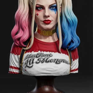 May include: A bust of a woman with blonde hair styled in pigtails, one pink and the other blue. She wears a red and white shirt with the text "May Olame Hi Memora". Her makeup includes red lipstick and blue and red accents.