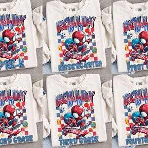 May include: A collection of six off-white t-shirts featuring a graphic of a cartoon superhero on a skateboard. The design includes a red and blue checkered background, school supplies, and the text Rollin' into Pre-K, Kindergarten, First, Second, Third, or Fourth Grade.