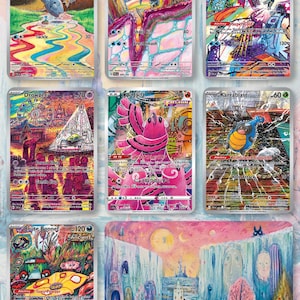 May include: A collection of nine Pok&eacute;mon trading cards featuring various characters and colorful artwork. The cards display different Pok&eacute;mon names, HP values, and attack descriptions. The artwork includes landscapes and character illustrations.