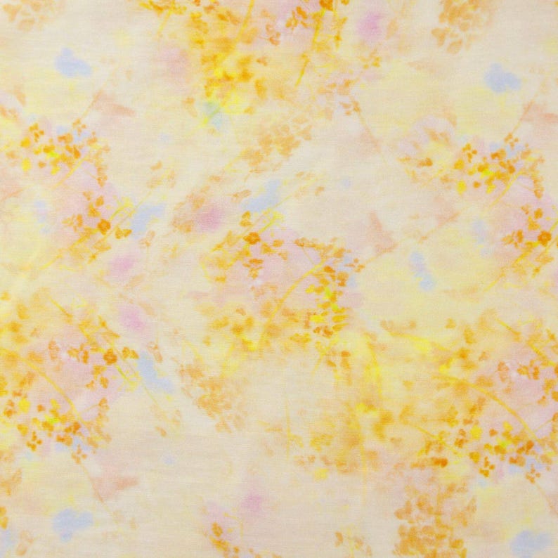 May include: A fabric with a watercolor-style floral pattern. The design features yellow, orange, and pink floral clusters on a pale yellow background. Light blue accents are scattered throughout the design.