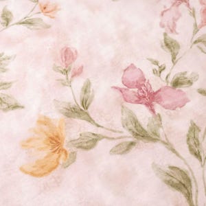 May include: Watercolor floral pattern featuring pink, peach, and yellow flowers with green leaves on a light pink textured background. The flowers are in various stages of bloom, creating a soft, romantic aesthetic.