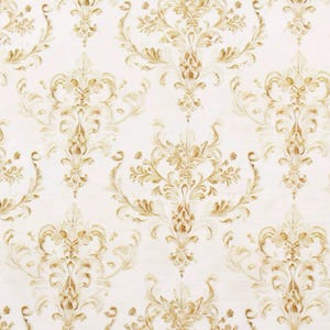 May include: Cream-colored wallpaper with a repeating pattern of ornate, gold-colored floral and scroll designs. The pattern is symmetrical, with large central motifs and smaller, complementary elements filling the spaces.
