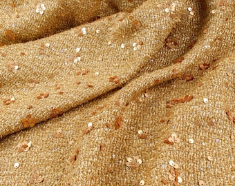 Tela de tweed con lentejuelas doradas, bordado floral de lúrex, textil de diseño.