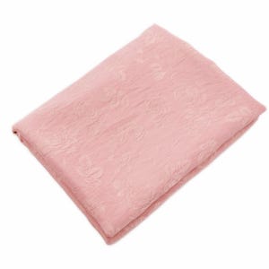 May include: A folded piece of light pink fabric featuring a subtle, tone-on-tone floral pattern with visible rose motifs. The material has a slightly crinkled, textured surface and is arranged in a neat, rectangular stack against a white background.