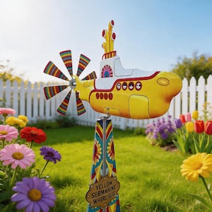 May include: A whimsical yellow submarine whirligig with a multi-colored propeller and decorative accents. The garden ornament features the text "YELLOW SUBMARINE WHIRLIGIG" on a small sign. Set in a garden with colorful flowers and a white picket fence.