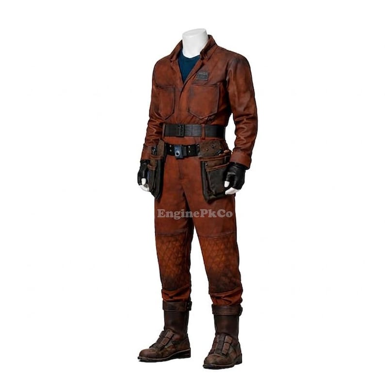 May include: A brown jumpsuit with a blue undershirt, black gloves, and a black belt with pouches. The jumpsuit has a textured pattern on the lower legs and is worn with brown boots. The text "EnginePkCo" is visible.
