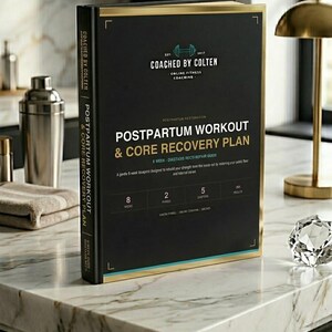 May include: A black book titled "Postpartum Workout & Core Recovery Plan" with gold trim. The book is by "Coached by Colten" and includes a fitness coaching logo. The book is on a marble countertop.