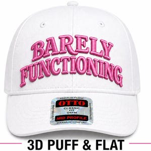 May include: White baseball cap with the embroidered text "BARELY FUNCTIONING" in pink. The cap has a curved brim and a classic fit. The image also includes a product label with the text "OTTO CLASSIC FIT OSFM MID PROFILE MAXIMUM COMFORT".
