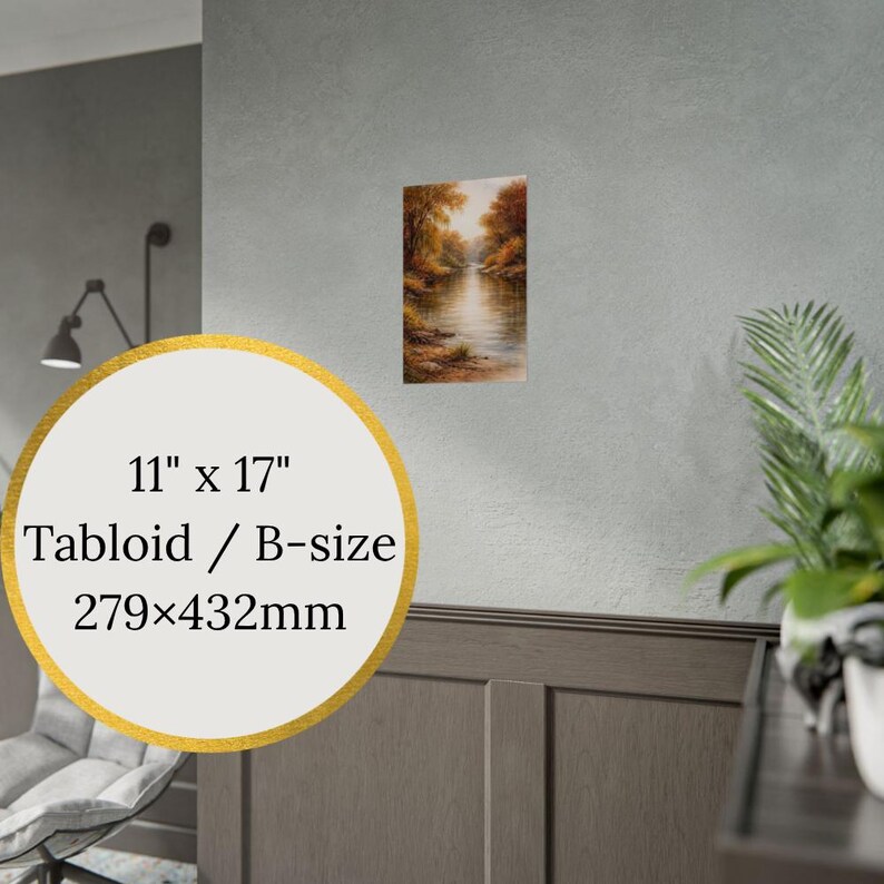 May include: An 11" x 17" print of a landscape painting. The artwork depicts a river scene with trees in autumn colors. The print is displayed on a wall with a gold-bordered label that reads "11" x 17" Tabloid / B-size 279x432mm".