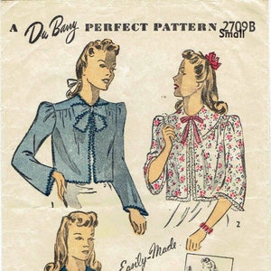 May include: Vintage sewing pattern for a blouse with a ruffled collar and short sleeves. The pattern is for size small and is from Du Barry Perfect Pattern 2709B. The pattern includes illustrated instructions for cutting and sewing.