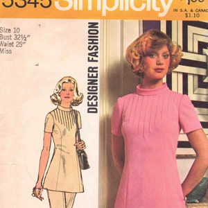May include: Simplicity sewing pattern number 5345, Designer Fashion, for a dress with a high neck and short sleeves. The pattern is for size 10, bust 32 1/2 inches, waist 25 inches, for a miss.