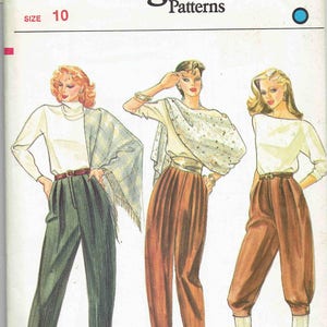 May include: Vogue sewing pattern number 8146, size 10, featuring three women wearing different styles of pants. The pattern includes instructions for making pants with a high waist and a wide leg.