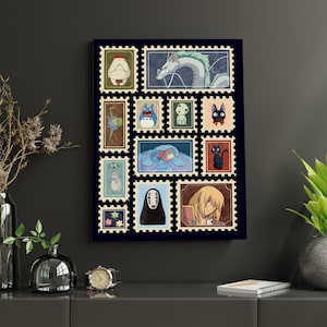 May include: A framed art print featuring a collection of colorful postage stamp designs. Each stamp showcases characters from animated films, including a white dragon, a black cat, and a figure with no face. The stamps are arranged on a dark blue background.