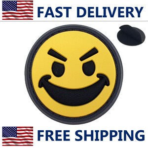 May include: A round, yellow emoji with a black, mischievous expression. The emoji has a black border and a matching adhesive backing. The words "FAST DELIVERY" and "FREE SHIPPING" are displayed.