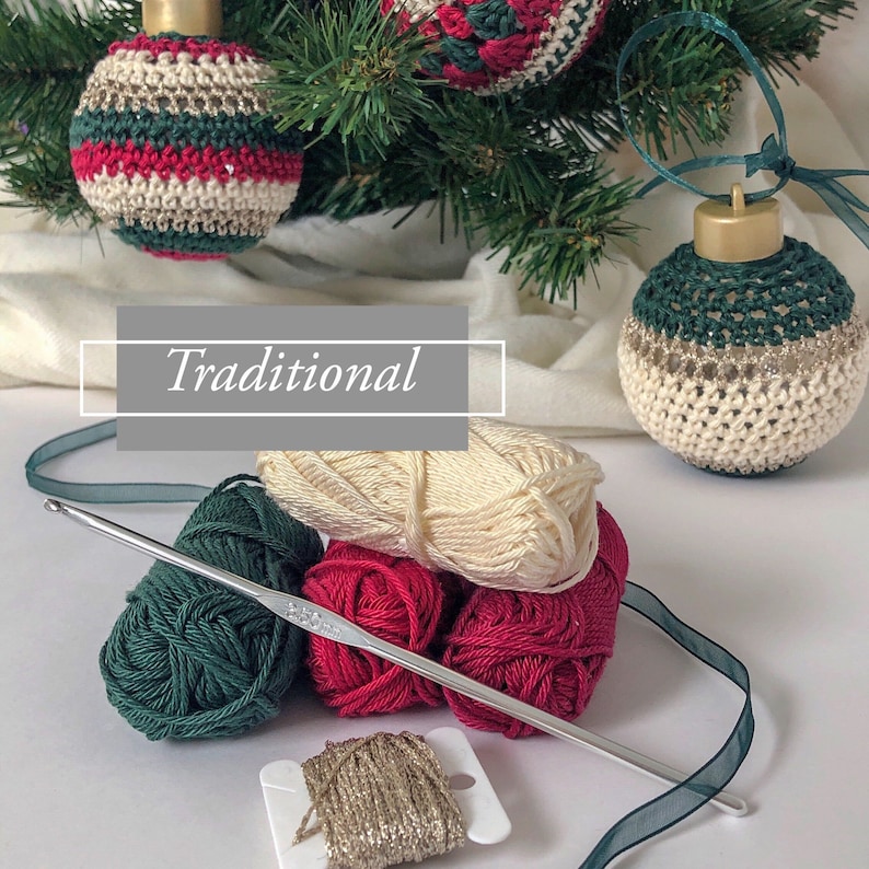 May include: Handmade Christmas baubles in red, green, and cream hang from a Christmas tree. The word "Traditional" is displayed in a gray box. Yarn, a crochet hook, and ribbon are also visible.