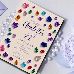May include: A rectangular invitation card with a cream background featuring scattered colorful gemstone illustrations. The text reads: Please join us to celebrate Charlotte's 21st Birthday, Saturday 26 July 2026, 7:30pm, The Gem Room, 123 Party Lane Chicago, IL, RSVP by 12 July, dress to dazzle.