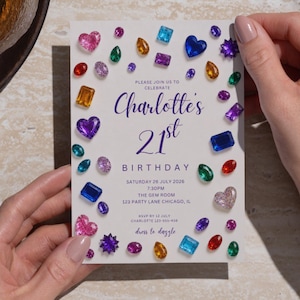 May include: A rectangular birthday invitation card featuring a white background decorated with various colorful gemstone illustrations. The text reads: Please join us to celebrate Charlotte's 21st Birthday, Saturday 26 July 2026, 7:30PM, The Gem Room, 123 Party Lane Chicago, IL.