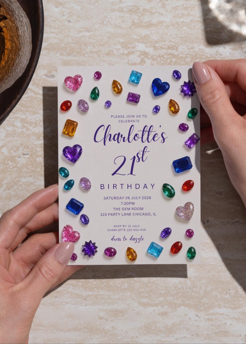 May include: A rectangular birthday invitation card featuring a white background decorated with various colorful gemstone illustrations. The text reads: Please join us to celebrate Charlotte's 21st Birthday, Saturday 26 July 2026, 7:30PM, The Gem Room, 123 Party Lane Chicago, IL.