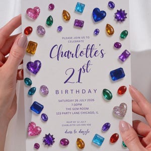 May include: A white rectangular birthday invitation card featuring a border of colorful, multi-shaped faux gemstones. The text reads: Please join us to celebrate Charlotte's 21st birthday, Saturday 26 July 2026, 7:30pm, The Gem Room, 123 Party Lane Chicago, IL.