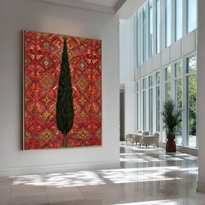 May include: A large rectangular wall art piece featuring a tall, slender green cypress tree centered against a vibrant red background with an intricate, repeating geometric pattern in shades of gold, orange, and dark brown throughout the design.