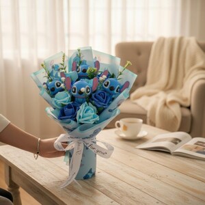 May include: A bouquet featuring blue plush Stitch characters and blue fabric flowers. The bouquet is wrapped in light blue paper and tied with a white ribbon that says "for you". The bouquet is on a wooden table.