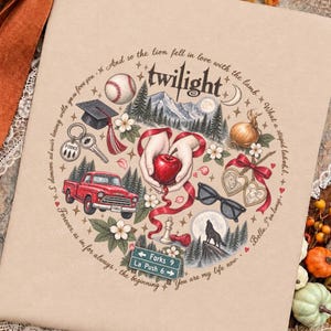 May include: A tan fabric surface featuring a circular illustration with the text Twilight. The design includes a baseball, graduation cap, red truck, apple held by hands, sunglasses, wolf, and a road sign reading Forks 9 and La Push 6.