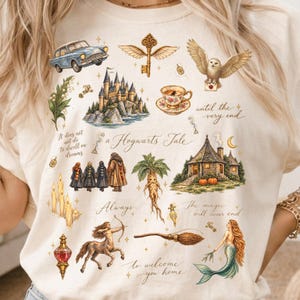 May include: A cream-coloured t-shirt featuring a collage of magical illustrations including a castle, a flying car, an owl, a mandrake, a centaur, a mermaid, and a broomstick, accompanied by the text "a Hogwarts Tale" and "Always."