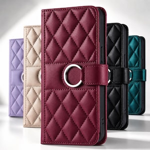 May include: A collection of five rectangular phone cases featuring a quilted diamond pattern and a central silver-toned metal ring on the closure tab. The cases are available in burgundy, lavender, beige, black, and teal, each with a smooth finish.