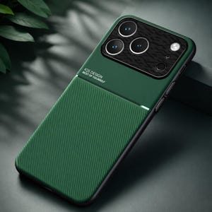 May include: Green phone case with a textured back and a black camera module. The case has the text "IQS DESIGN BEST OF YOURSELF" printed on it. The case is designed to protect the phone from scratches and damage.